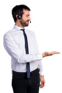 Young man with a headset presenting something Young man with a headset presenting something